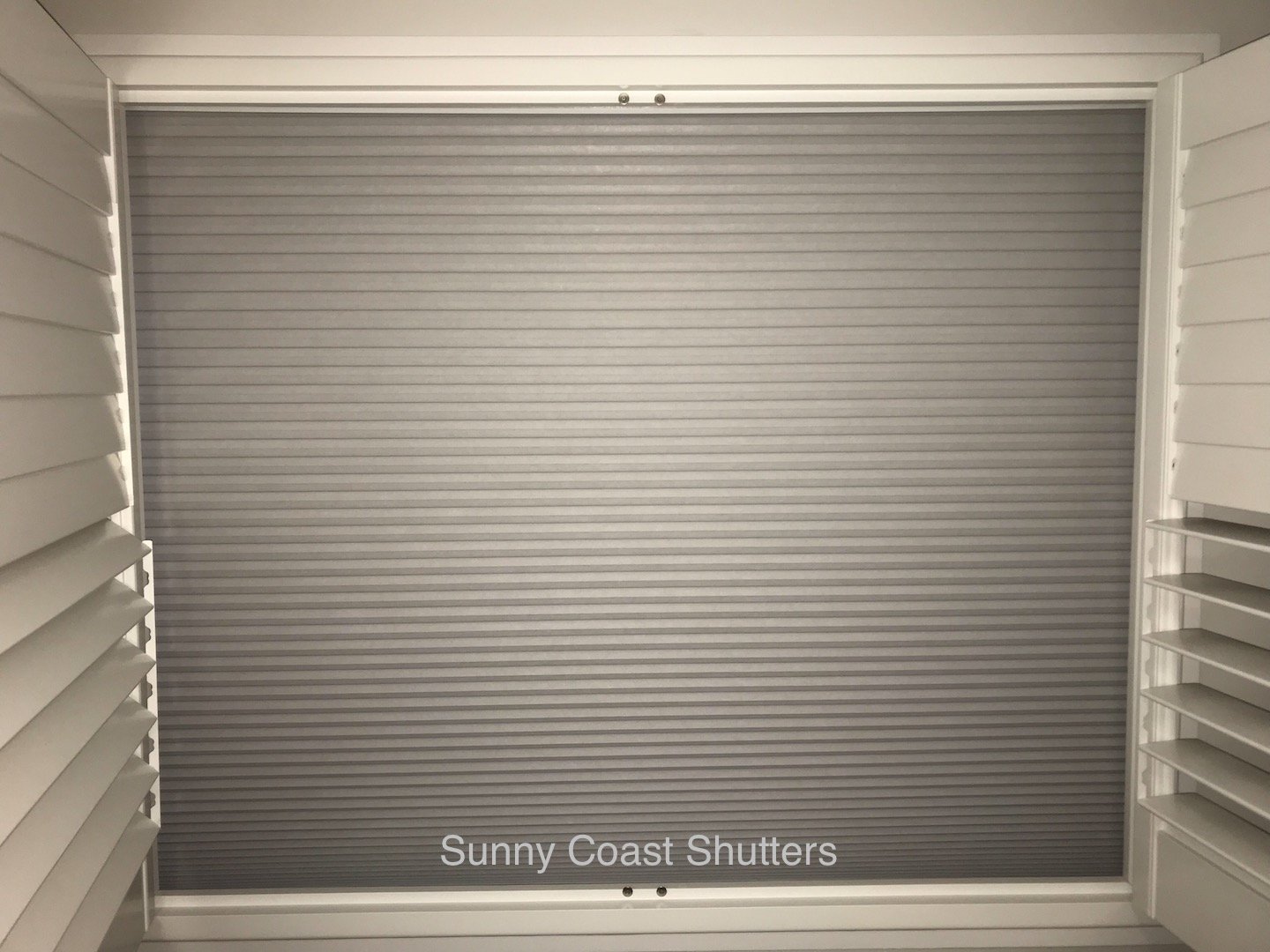 block out cellular blind with shutters 