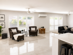 large white plantain shutters making light roomy living area modern family home
