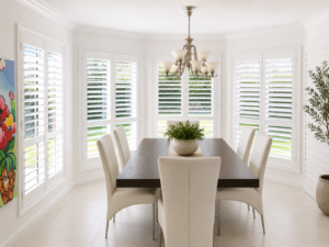 White plantation shutters in modern dining room clean fresh look
