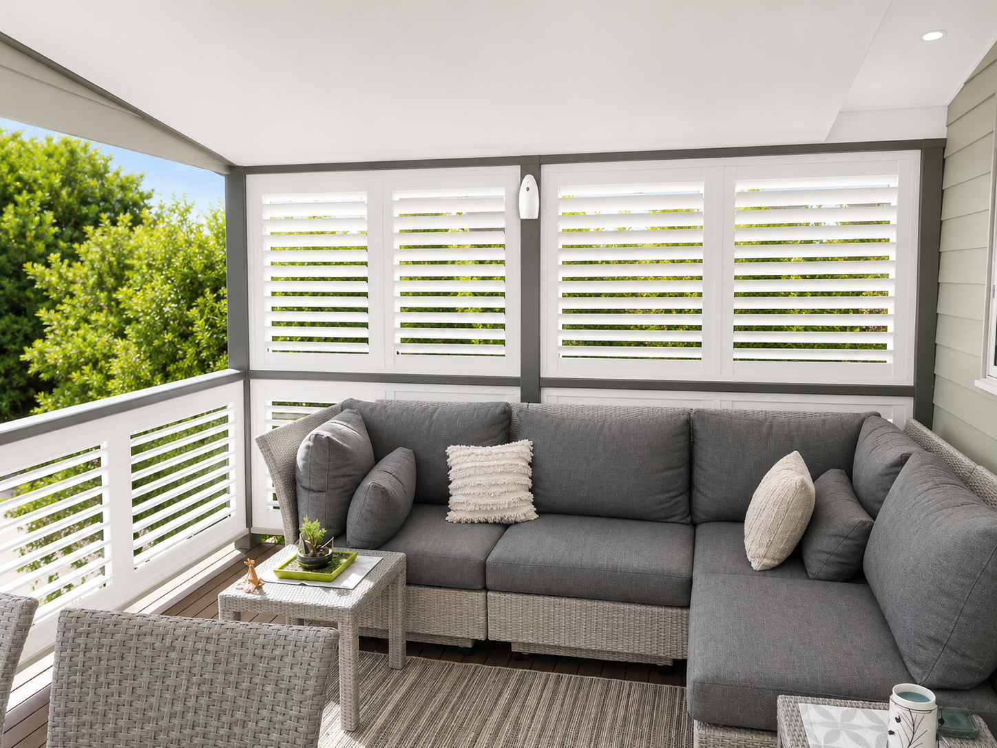 white outdoor plantation shutters for the deck area